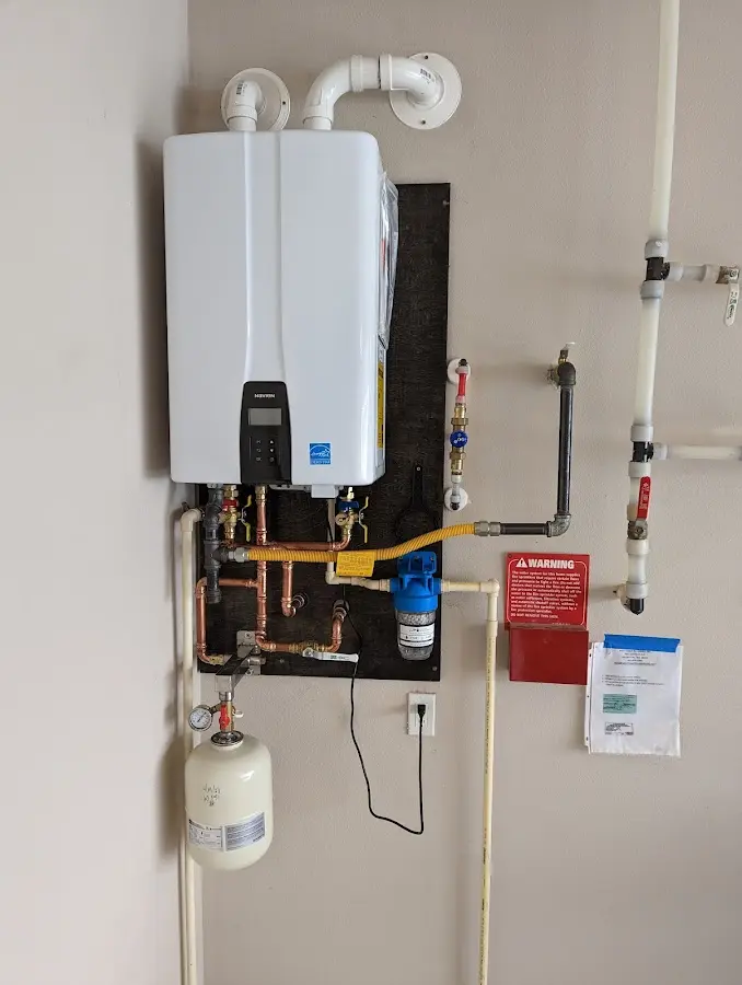 Professional plumber installing copper piping in a South Alamo home